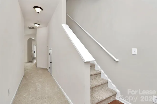 a view of hallway with stairs