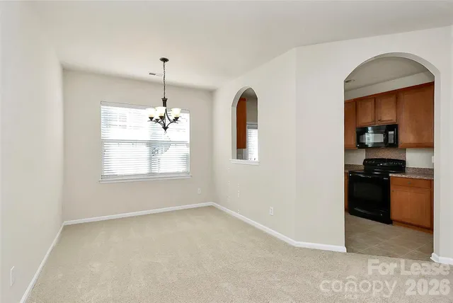 a view of a kitchen with a sink cabinet and a window