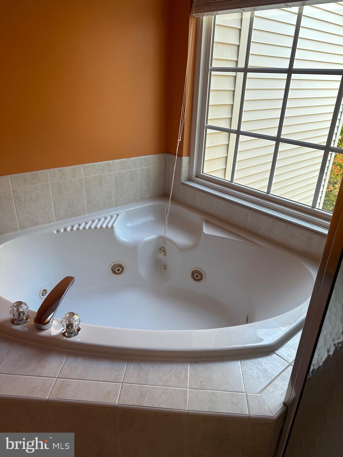 9077 Two Bays Road Lorton, VA 22079 - Photo 12 of 22 a bathroom with a tub and a window
