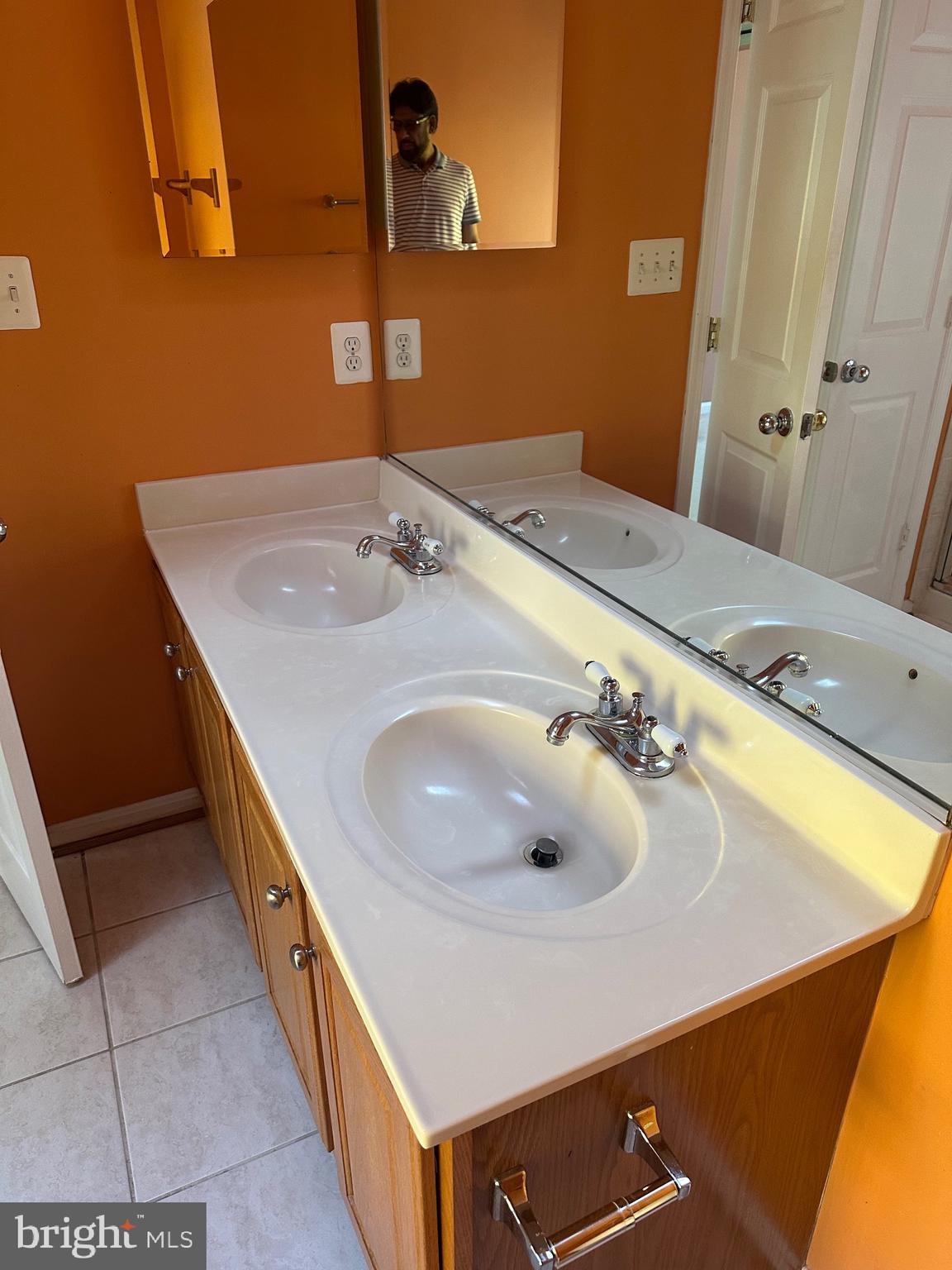 9077 Two Bays Road Lorton, VA 22079 - Photo 13 of 22 a bathroom with a sink and a mirror