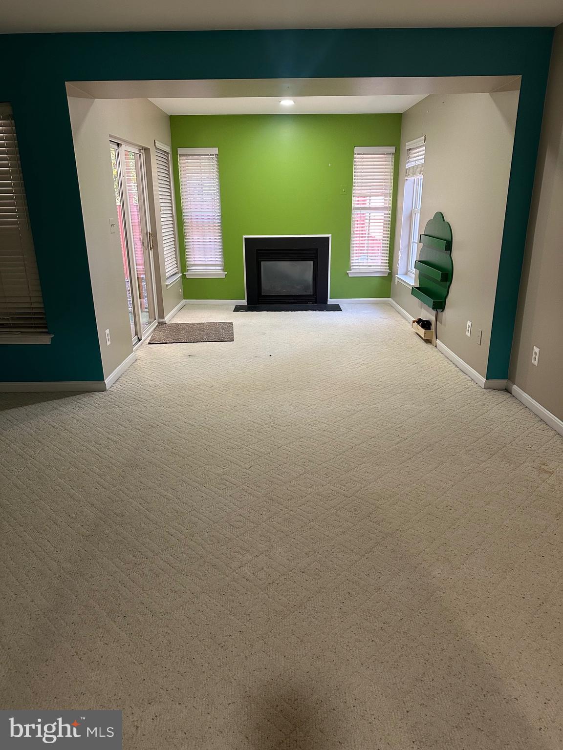 9077 Two Bays Road Lorton, VA 22079 - Photo 16 of 22 a view of a livingroom with an empty space and a fireplace