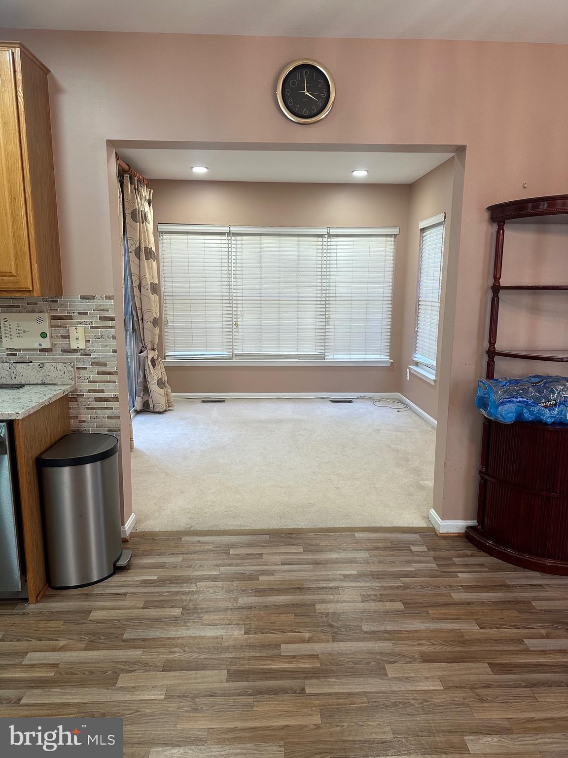 9077 Two Bays Road Lorton, VA 22079 - Photo 6 of 22 a view of a kitchen with a sink and a fireplace