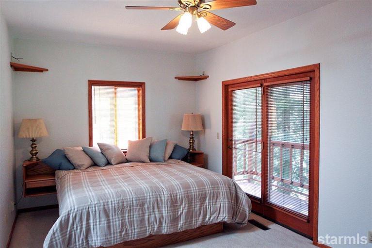 272 Chimney Rock Road Stateline, NV 89449 - Photo 29 of 35 a bedroom with a large bed and a window