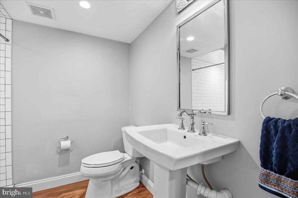 16146 Thomas Road Piney Point, MD 20674 - Photo 9 of 70 a bathroom with a sink toilet and a mirror