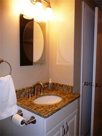 111 Scully Road Somers, CT 06071 - Photo 15 of 26 a bathroom with a sink and mirror