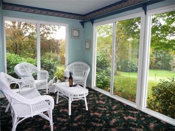 111 Scully Road Somers, CT 06071 - Photo 7 of 26 a living room with patio furniture and a floor to ceiling window