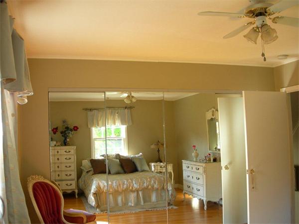 111 Scully Road Somers, CT 06071 - Photo 9 of 26 a living room with furniture and a chandelier