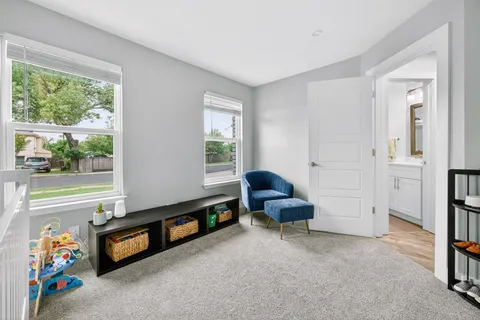 a living room with furniture and a window