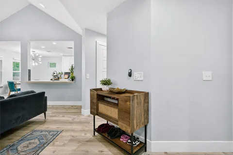 a bedroom with furniture and a window