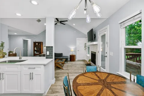 a kitchen with a sink appliances and cabinets