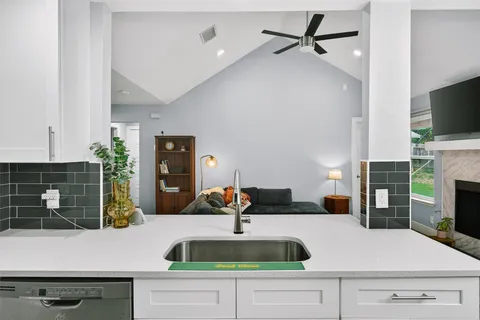 a kitchen with a sink stove and refrigerator