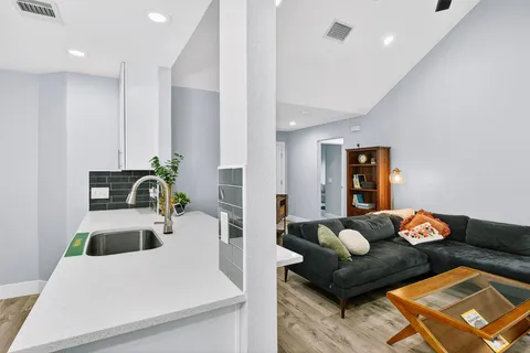 a kitchen with stainless steel appliances a stove microwave and refrigerator