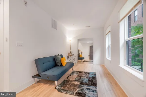 a living room with furniture and a rug