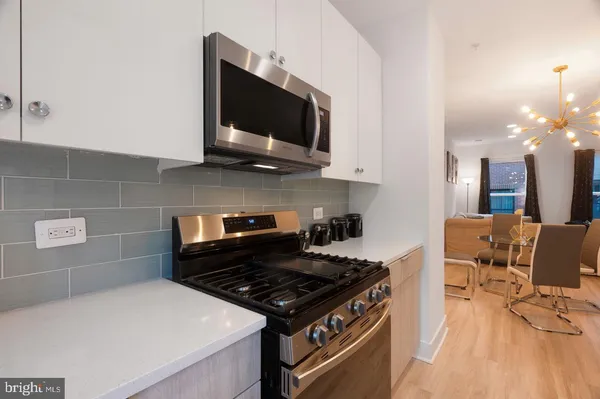 a kitchen with a stove and a microwave