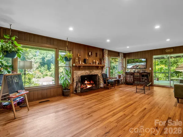 a view of a dining room with a table and chairs