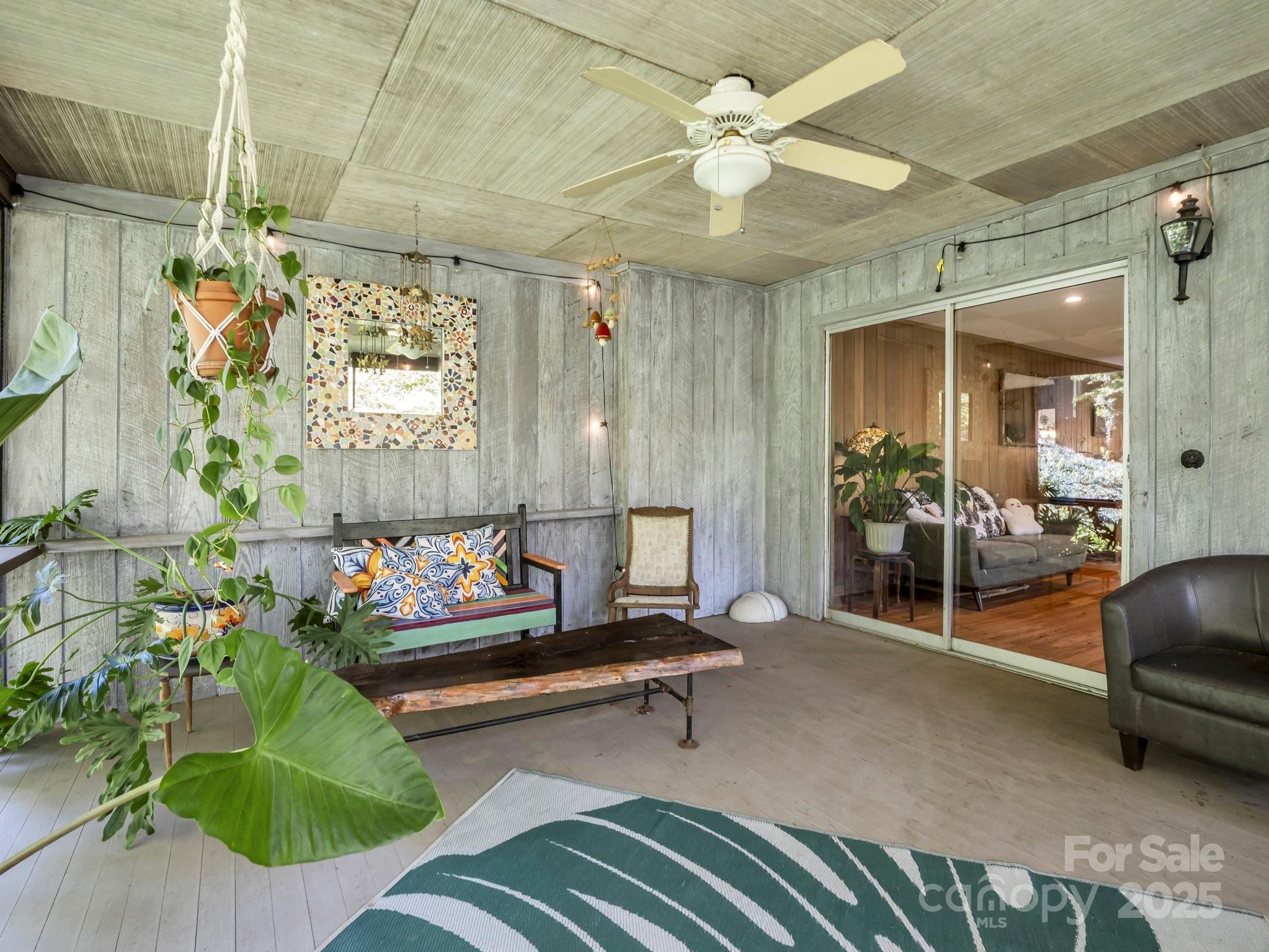 81 Jericho Drive Tryon, NC 28782 - Photo 17 of 43 a living room with furniture and a chandelier