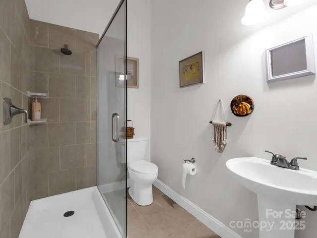 a view of a lush green hillside and a building