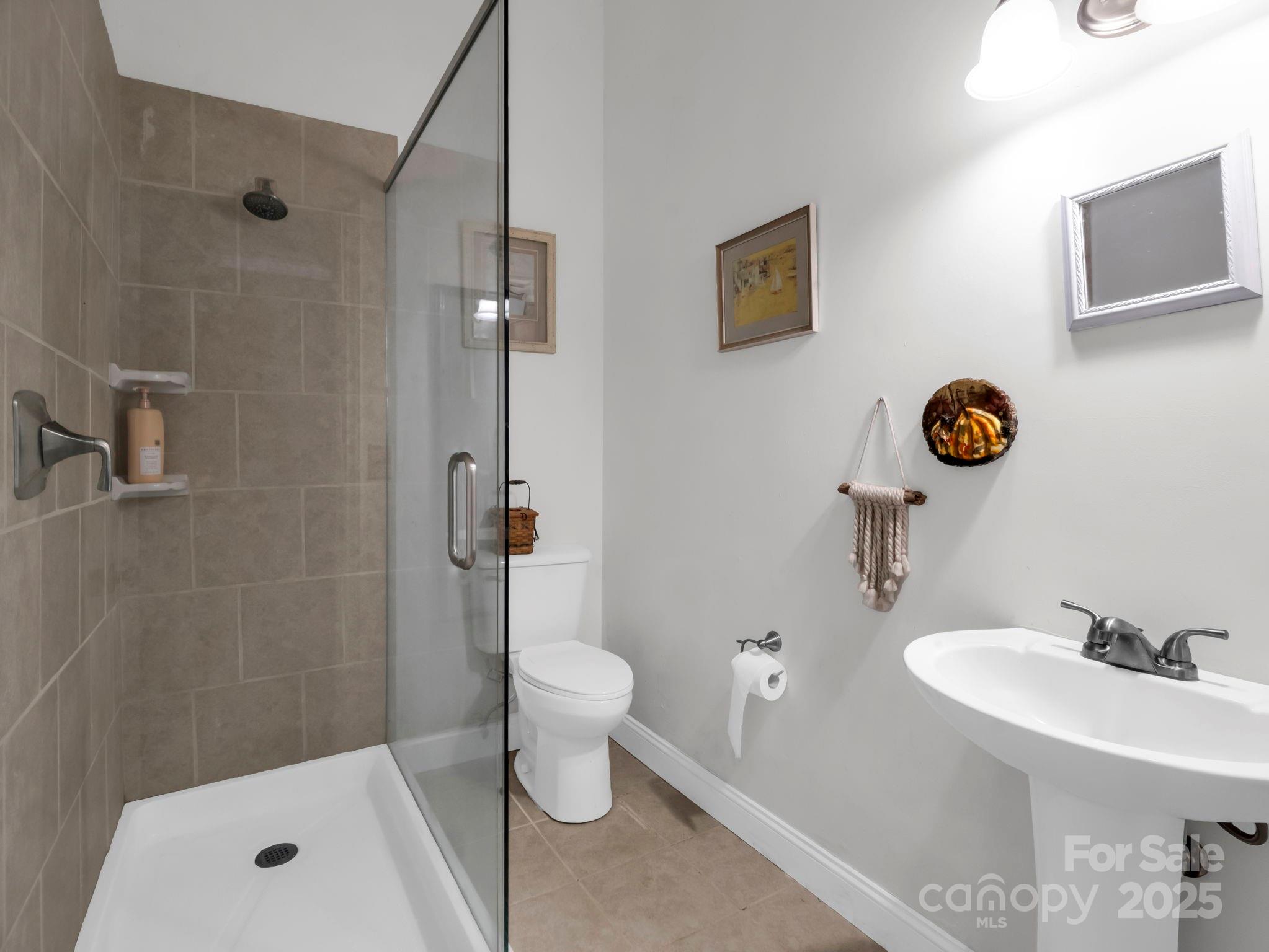 81 Jericho Drive Tryon, NC 28782 - Photo 28 of 43 a bathroom with a sink toilet and shower