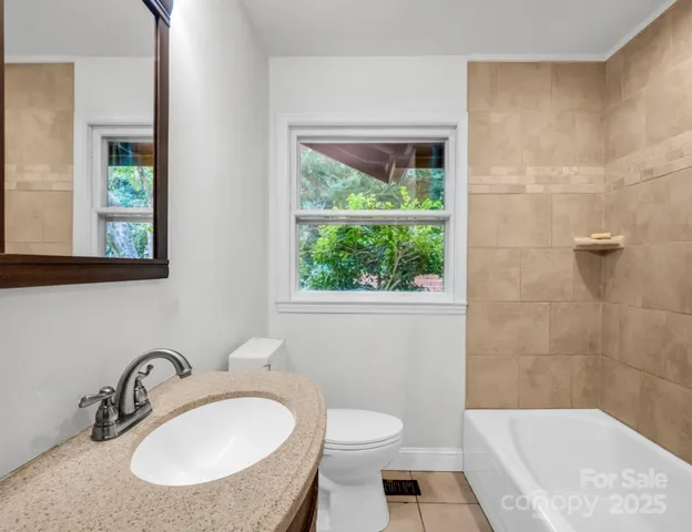 a view of a big yard with green space and mountain view