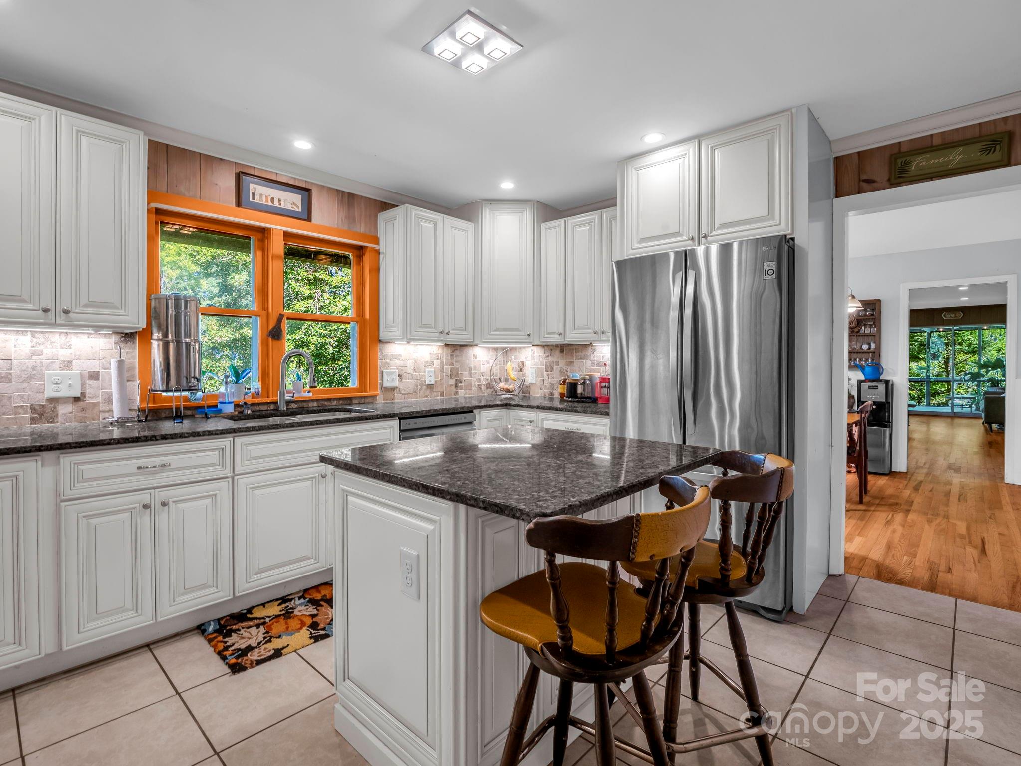 81 Jericho Drive Tryon, NC 28782 - Photo 7 of 43 a kitchen with stainless steel appliances granite countertop a stove a sink and a refrigerator