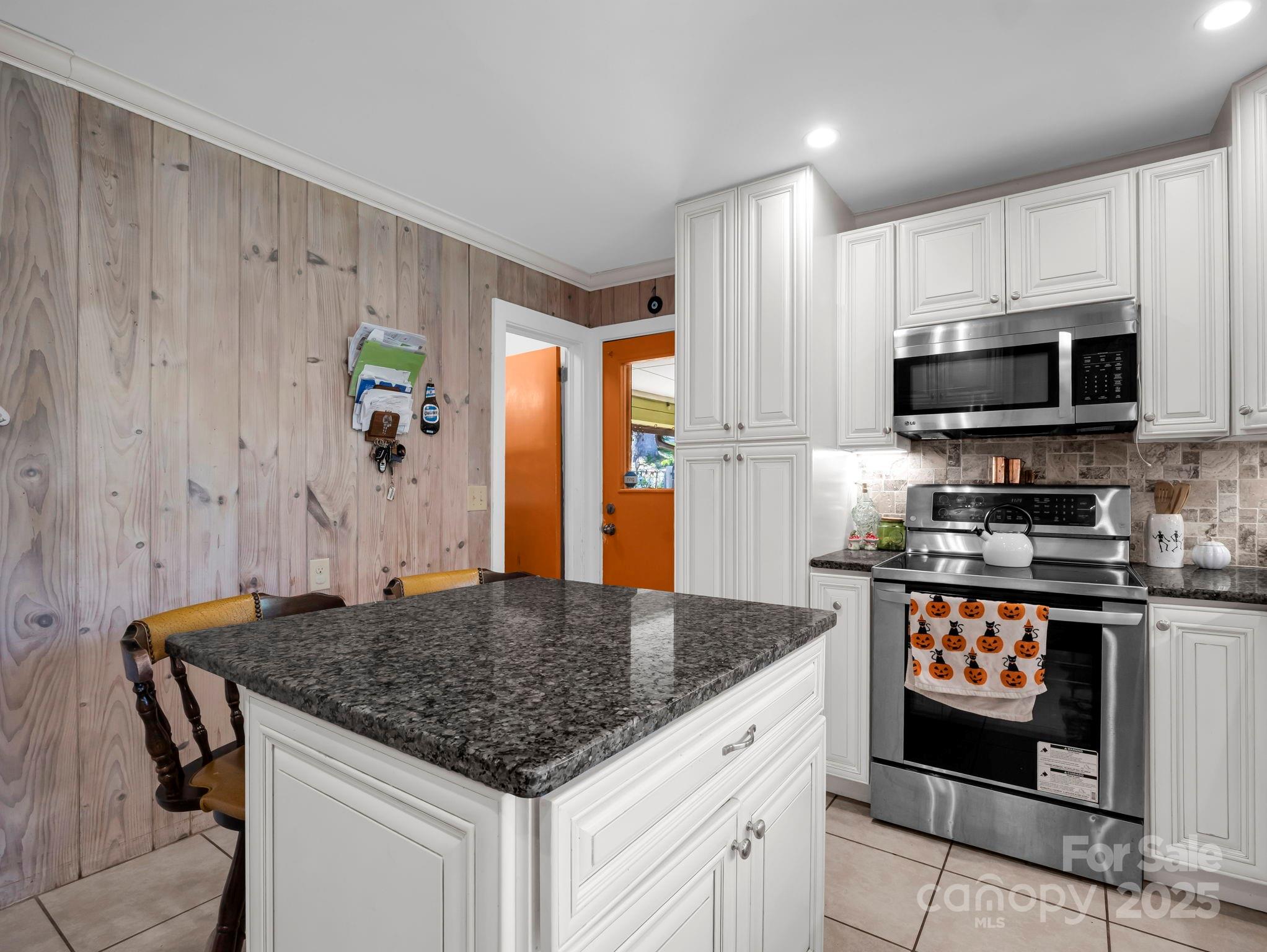 81 Jericho Drive Tryon, NC 28782 - Photo 9 of 43 a kitchen with stainless steel appliances granite countertop a stove a sink and a refrigerator