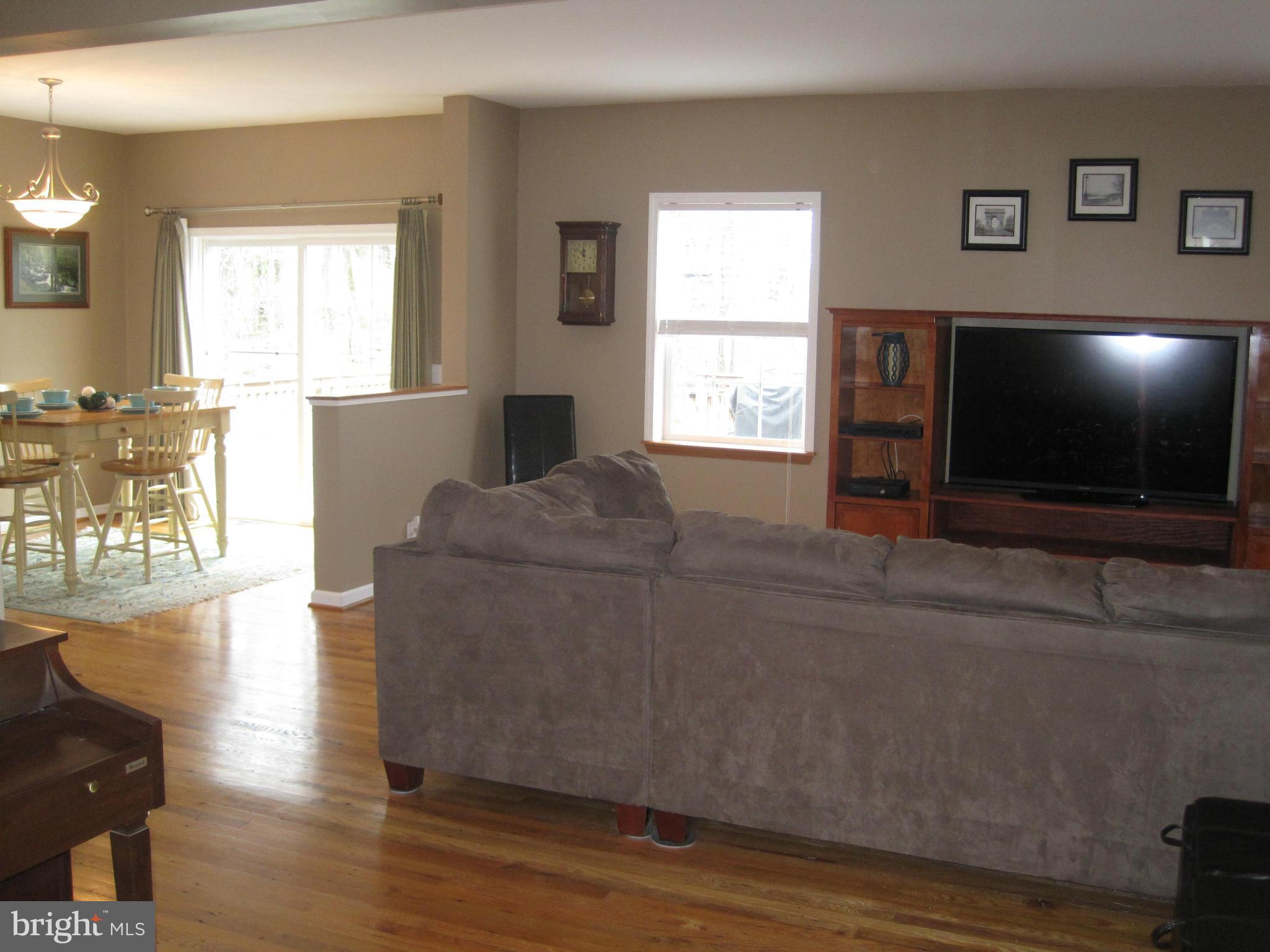541 Stringtown Road Berryville, VA 22611 - Photo 4 of 19 a living room with furniture and a flat screen tv