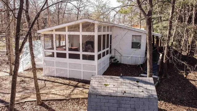 a front view of a house with large windows