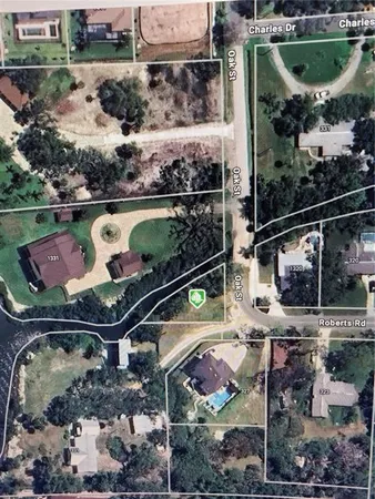 an aerial view of residential houses with outdoor space and swimming pool