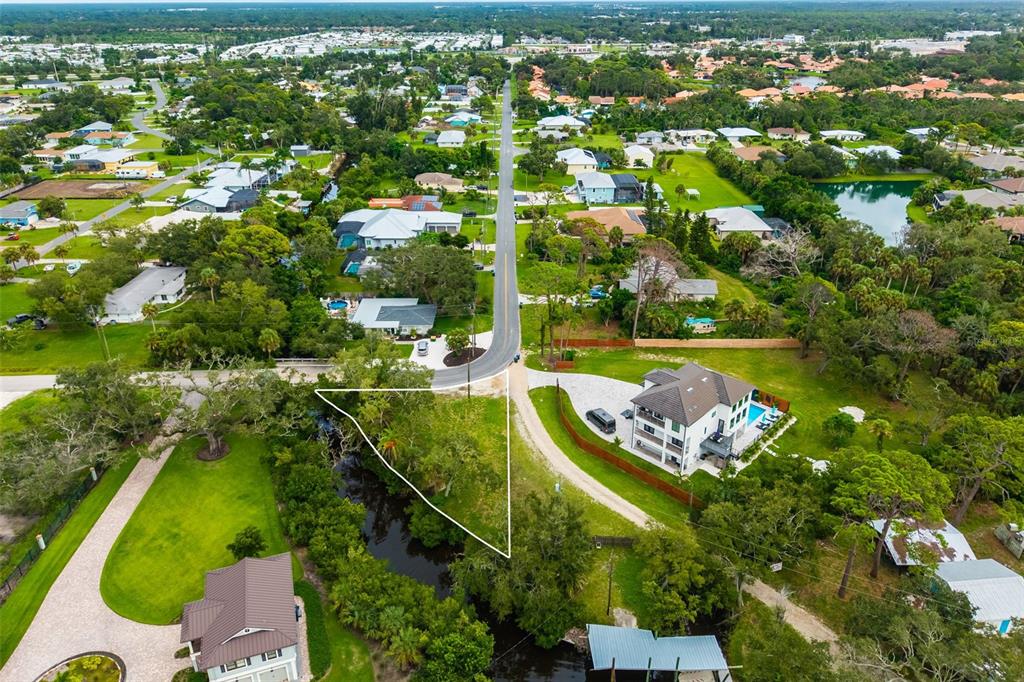 Oak Street Nokomis, FL 34275 - Photo 4 of 20 an aerial view of residential houses with outdoor space and swimming pool