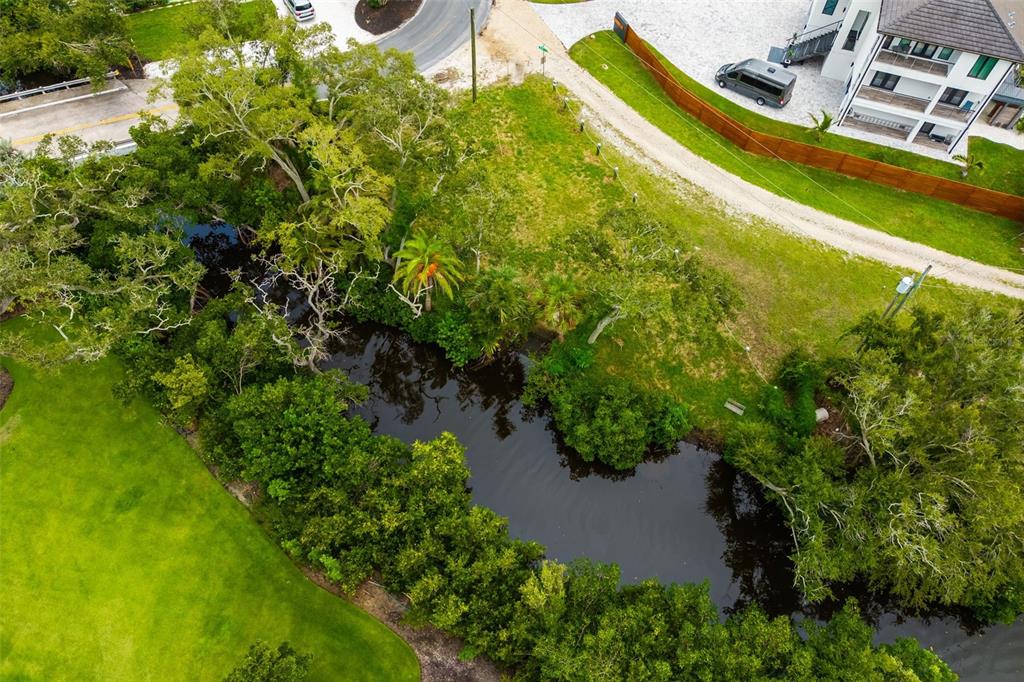 Oak Street Nokomis, FL 34275 - Photo 9 of 20 an aerial view of a house with a yard and swimming pool