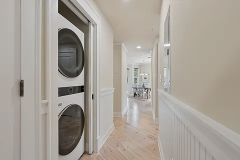 a view of a hallway with washer and dryer