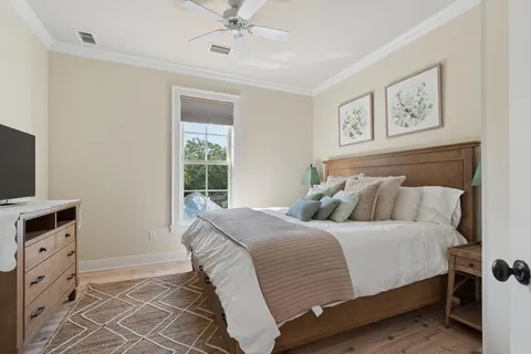a bedroom with a large bed and a window