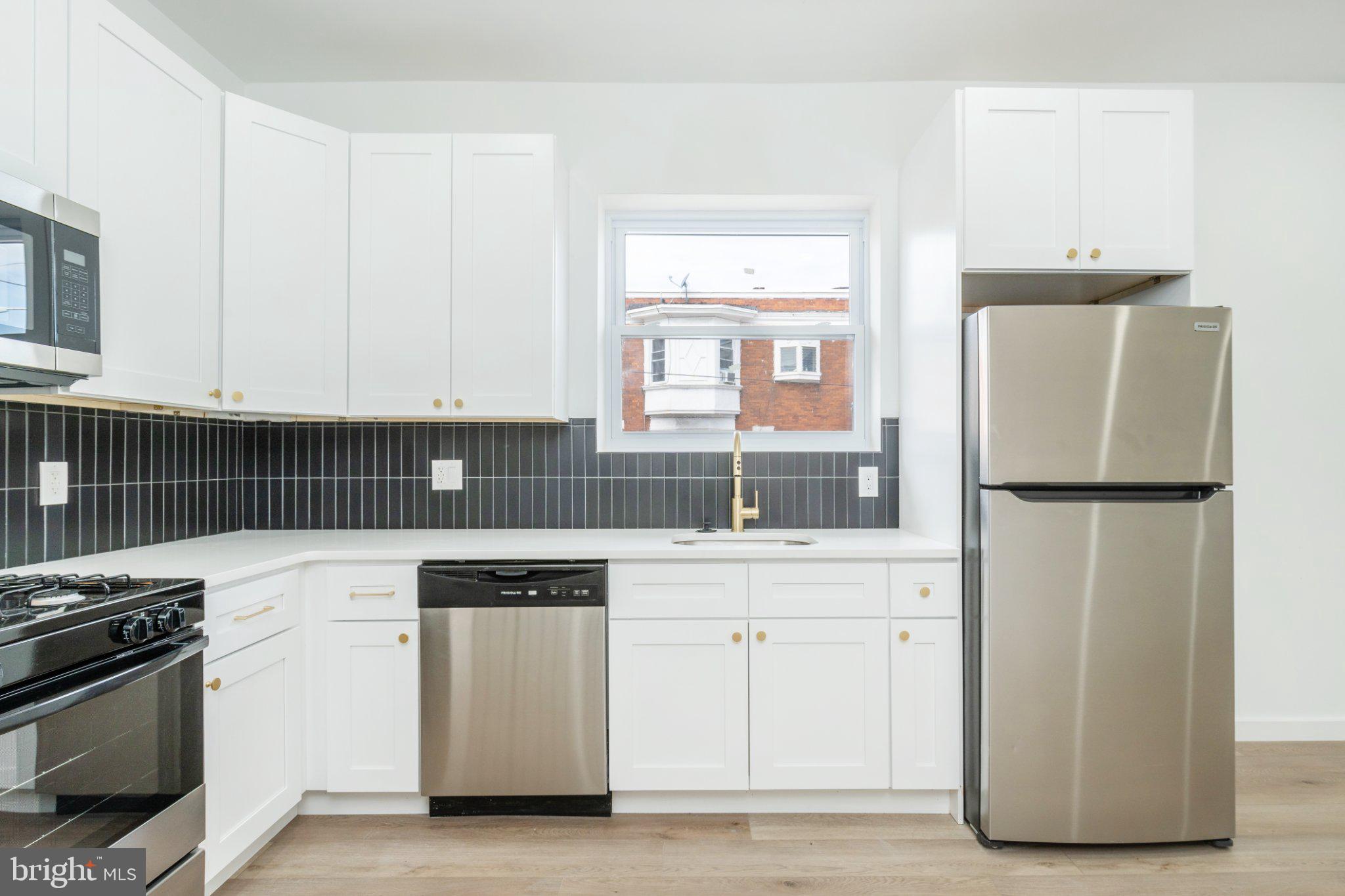 5758 Spruce Street Philadelphia, PA 19139 - Photo 11 of 44 Modern kitchen with sleek finishes.
