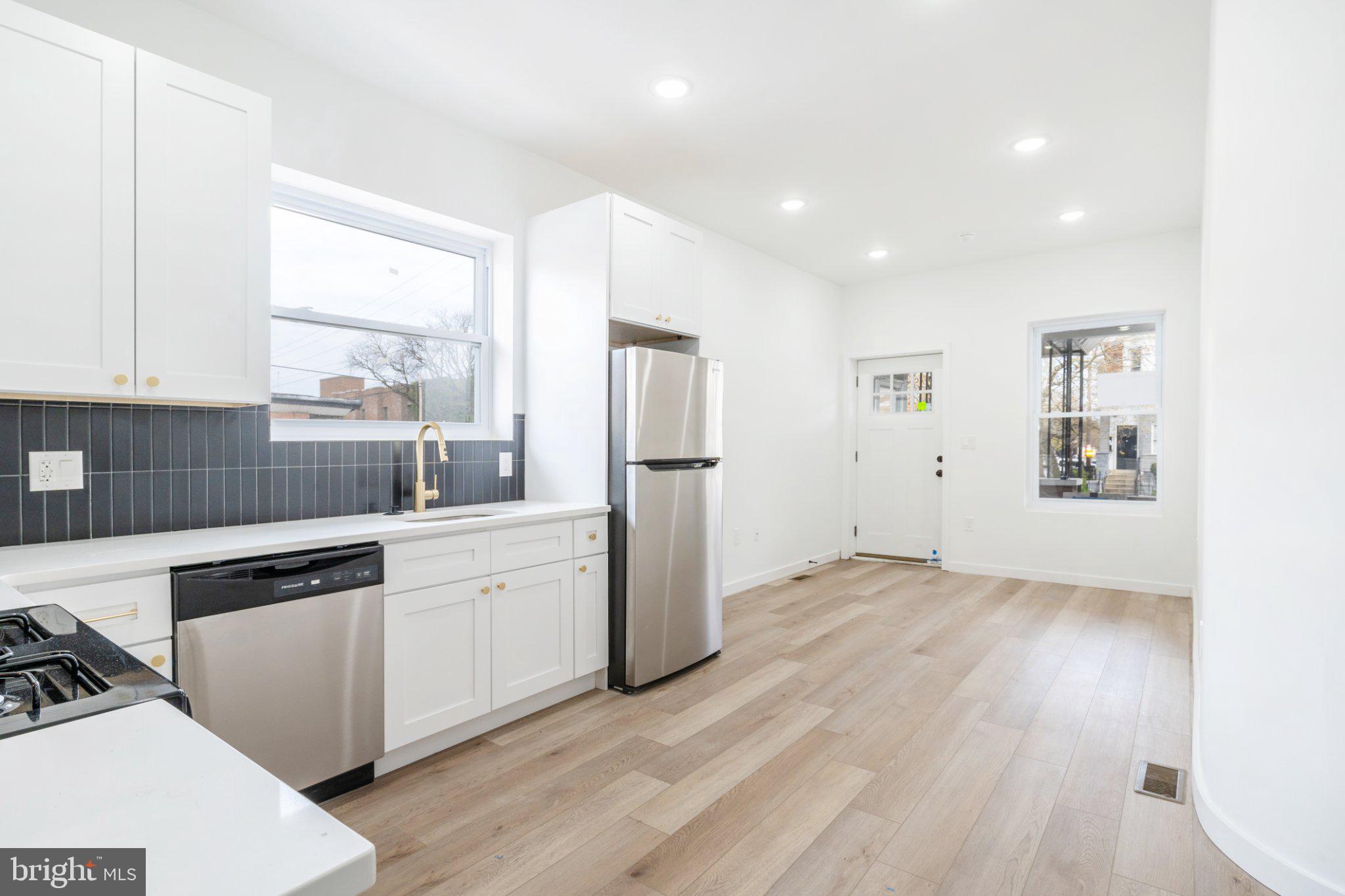 5758 Spruce Street Philadelphia, PA 19139 - Photo 12 of 44 Bright and airy modern kitchen space.