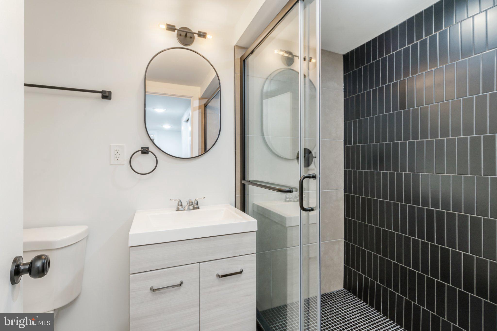 5758 Spruce Street Philadelphia, PA 19139 - Photo 14 of 44 Sleek modern bathroom retreat.