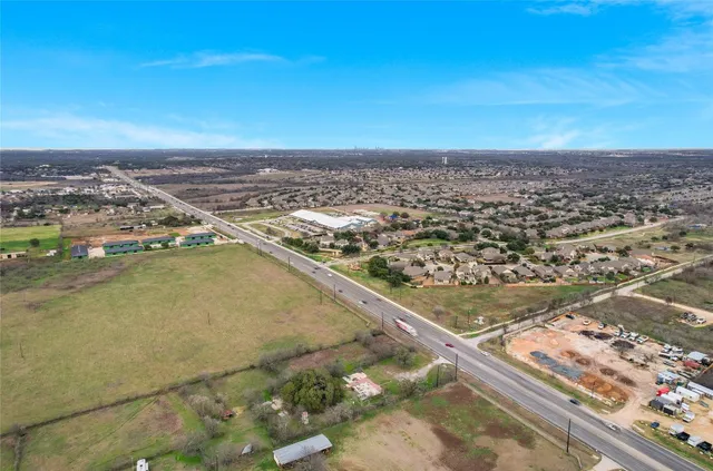 an aerial view of residential building and ocean