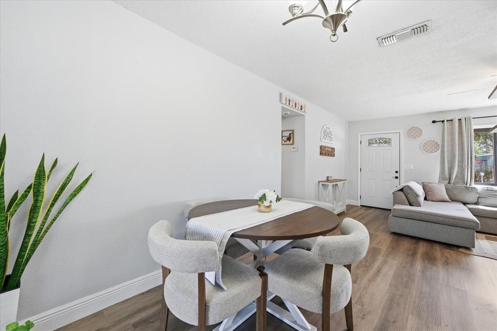 3487 Begonia Place Largo, FL 33771 - Photo 21 of 34 a view of a livingroom with furniture and wooden floor