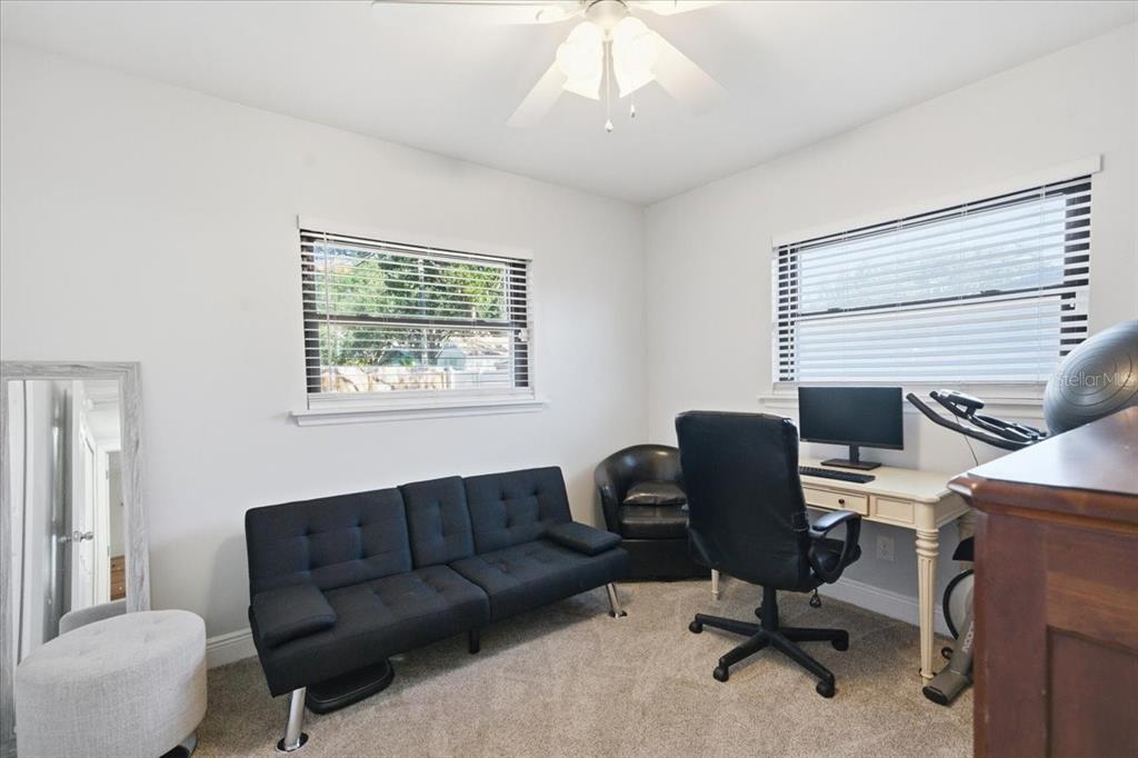 3487 Begonia Place Largo, FL 33771 - Photo 27 of 34 a view of a livingroom with workspace and a window