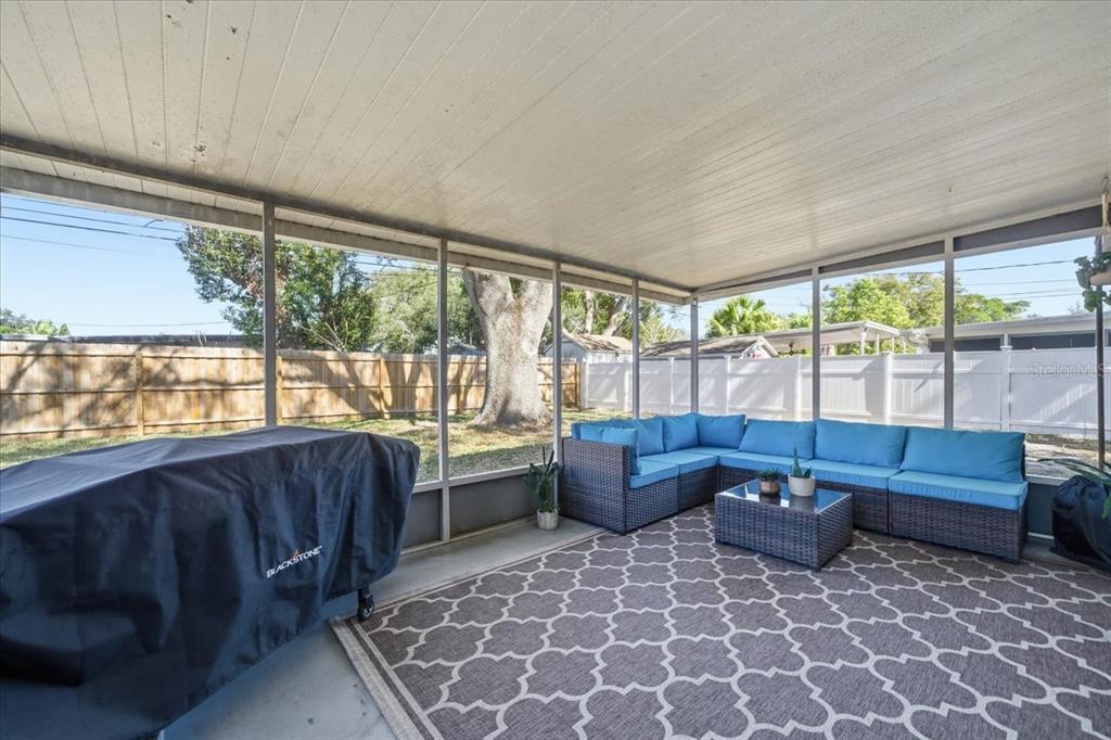 3487 Begonia Place Largo, FL 33771 - Photo 30 of 34 a living room with furniture and large windows