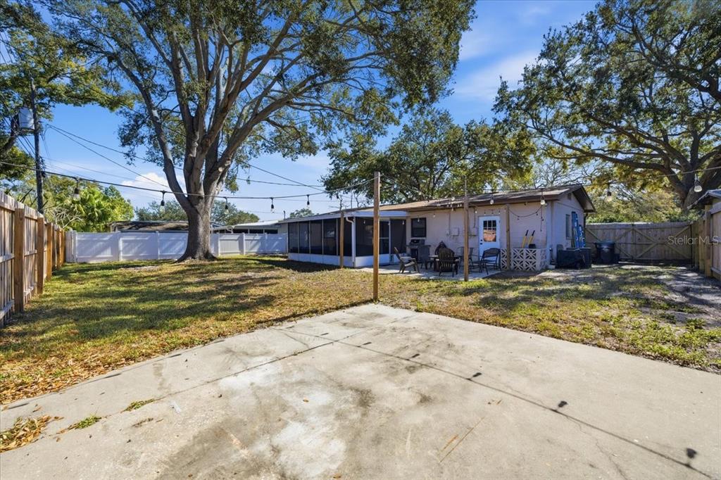 3487 Begonia Place Largo, FL 33771 - Photo 33 of 34 a view of a house with a yard and large tree
