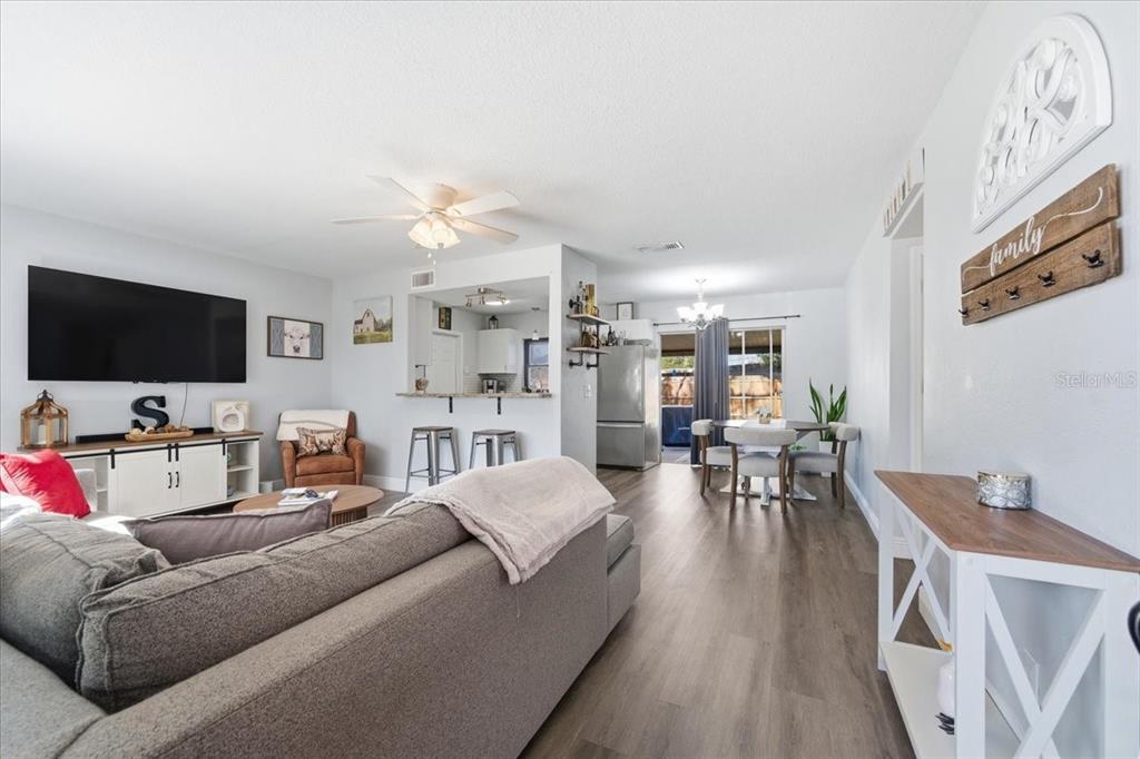 3487 Begonia Place Largo, FL 33771 - Photo 5 of 34 a living room with furniture and a flat screen tv