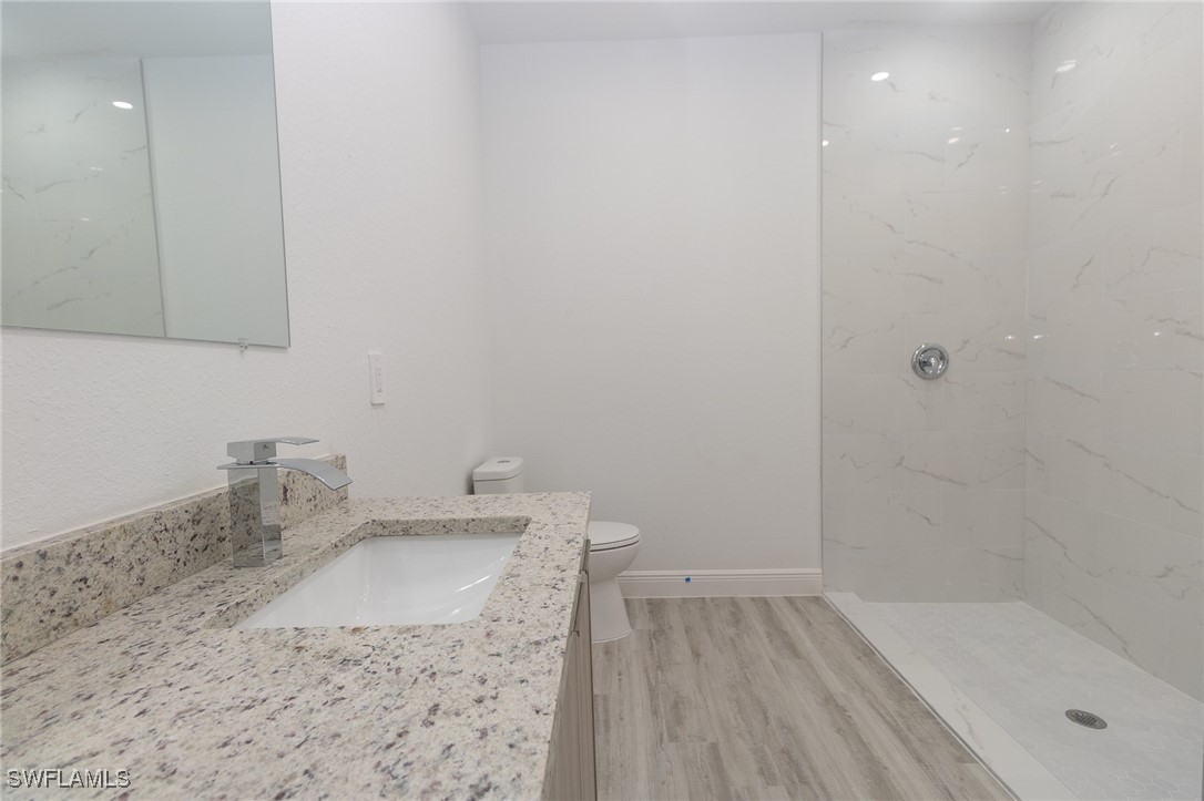 3105 Myra Lane LaBelle, FL 33935 - Photo 11 of 29 a bathroom with a sink and a bathtub