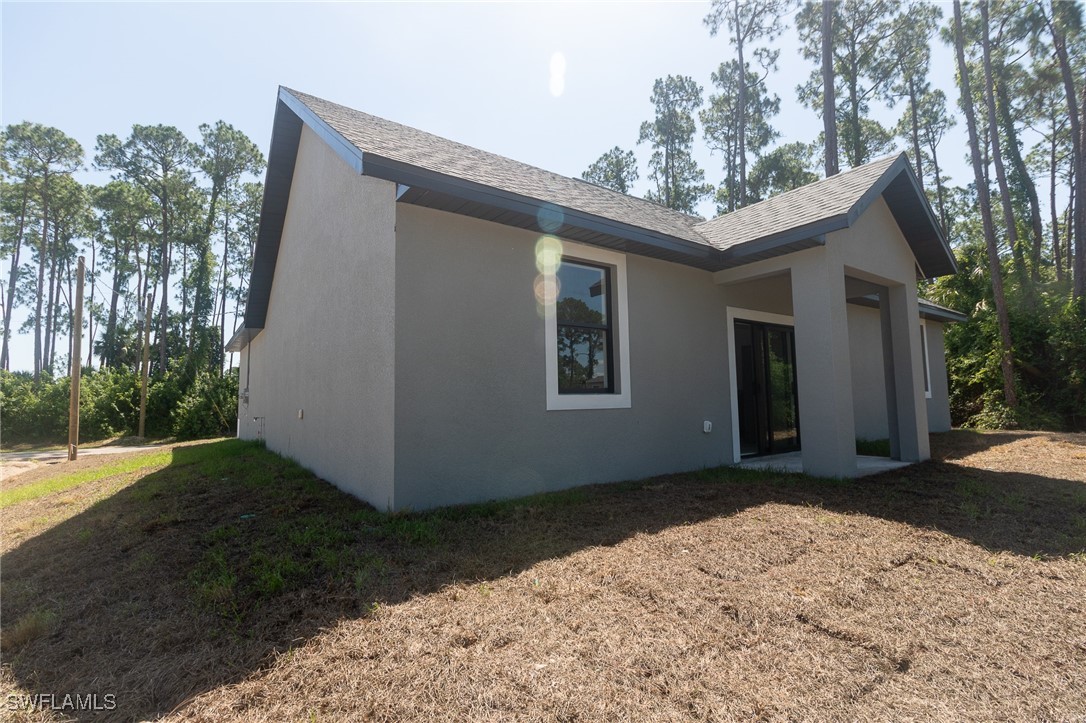 3105 Myra Lane LaBelle, FL 33935 - Photo 24 of 29 a backyard of a house with lots of green space