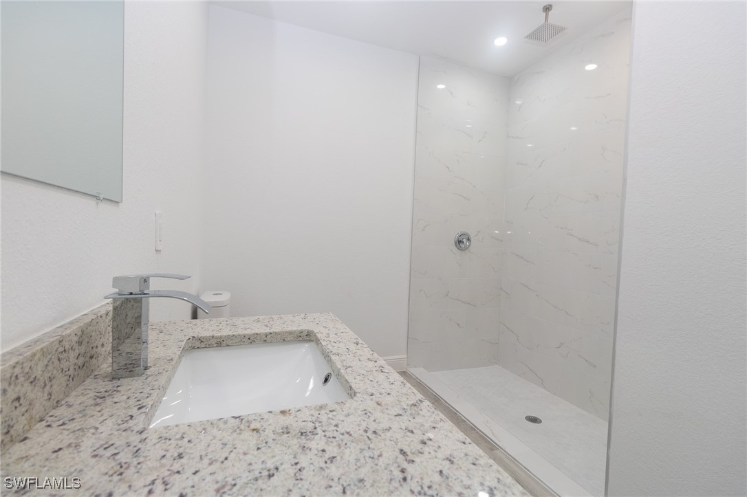 3105 Myra Lane LaBelle, FL 33935 - Photo 10 of 29 a bathroom with a sink a toilet and shower