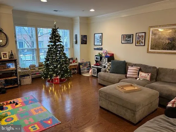 a view of a livingroom with furniture and a flat screen tv