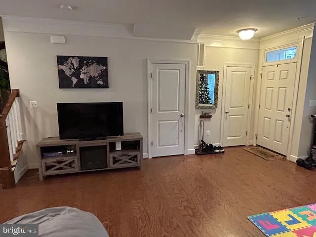 a view of entryway with wooden floor