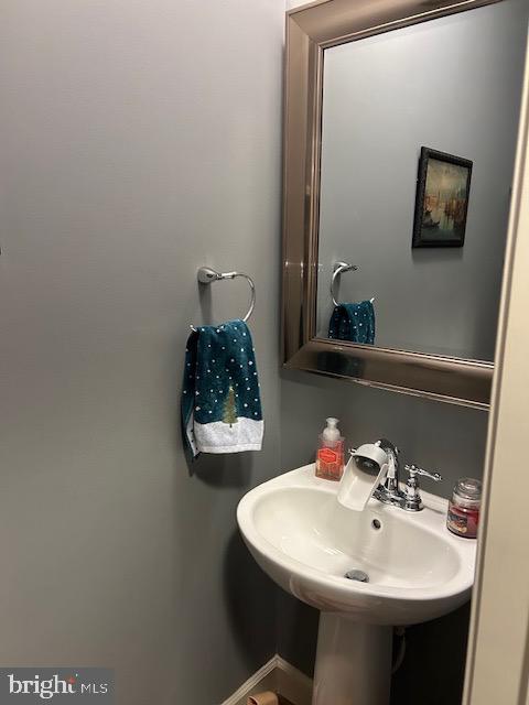 8912 Tawes Street Fulton, MD 20759 - Photo 19 of 21 a bathroom with a sink and a mirror