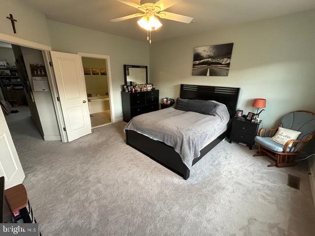 8912 Tawes Street Fulton, MD 20759 - Photo 10 of 21 a spacious bedroom with a bed and a chandelier
