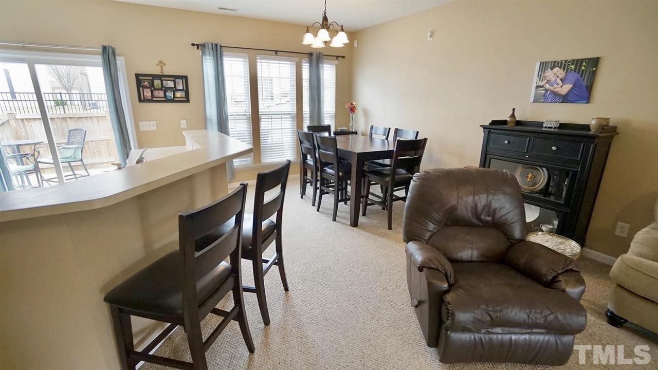 8330 Saltwood Place Raleigh, NC 27617 - Photo 14 of 27 a dining room with furniture and window