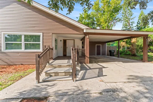 a spacious bathroom with a granite countertop sink mirror and a toilet